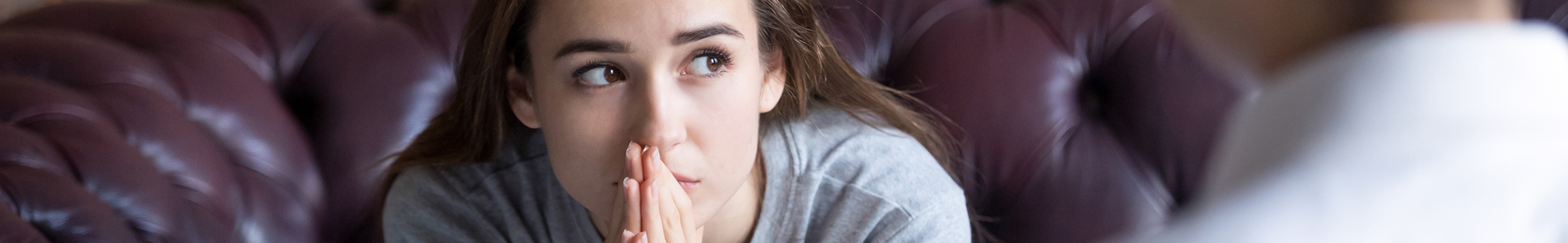 Unhappy young girl at the psychologist