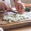 onion being diced on a cutting board