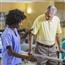 Female physical therapist working with male patient