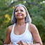 Senior woman jogging in public park