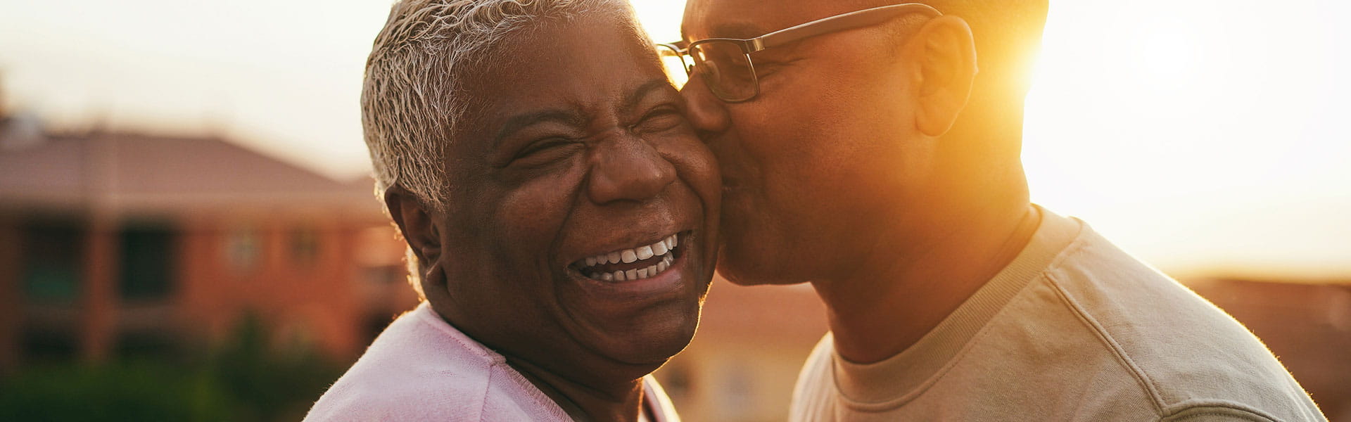 Man kissing woman's cheek